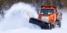 Snow plow truck plowing snow