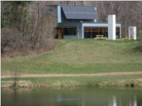 Bagley Nature Area Classroom Pavilion as seen from across a pond.